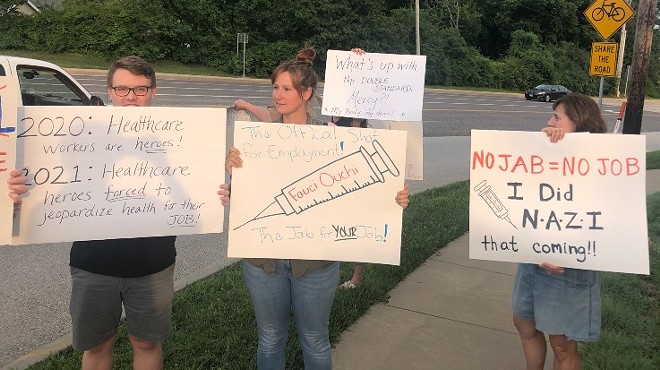 Protesters outside of Mercy Hospital St. Louis   on Sunday protest a policy to require employees to get vaccinated.