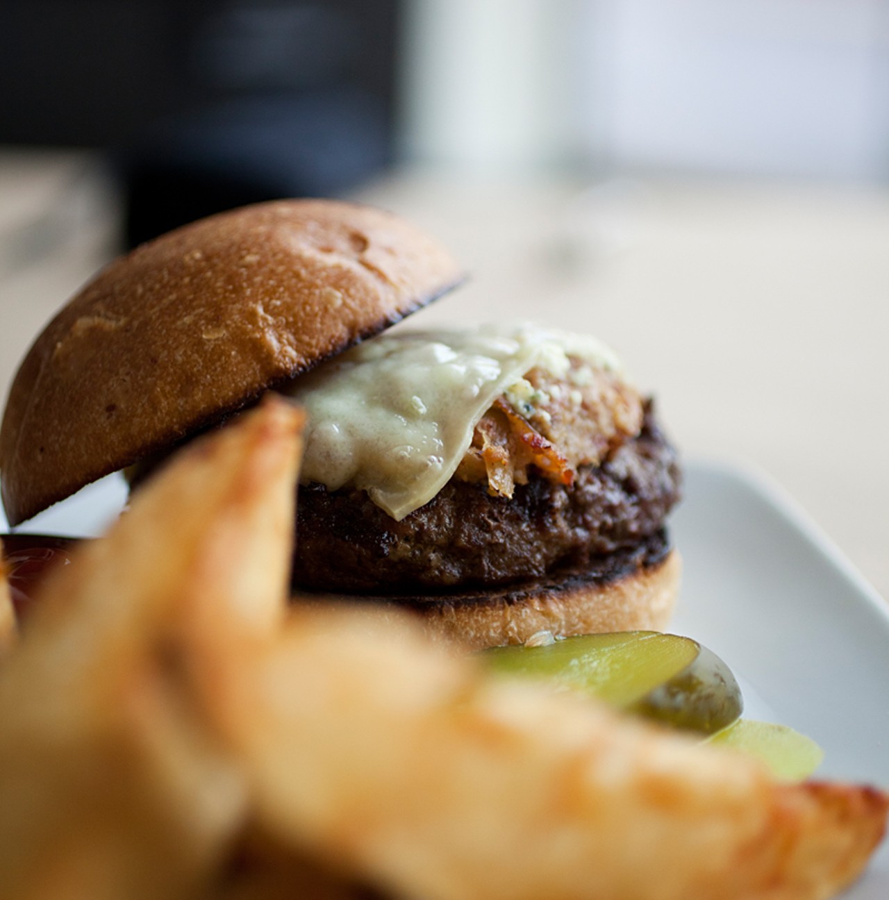 The burger: eight ounces of Angus beef, gruyere and bleu cheeses, and onion and bacon compote on a brioche bun.