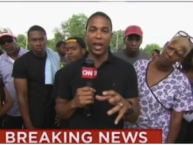 Don Lemon reporting while people look at him skeptically.