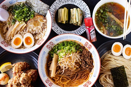 A selection of items from Menya Rui (clockwise from top left): pork shoyu ramen, house cucumbers, original tsukemen, tantanmen brothless and karaage.