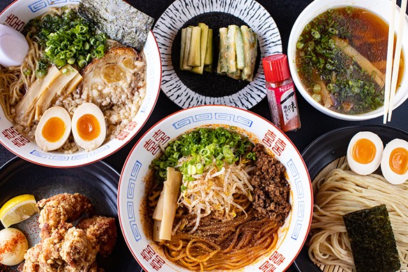 A selection of items from Menya Rui (clockwise from top left): pork shoyu ramen, house cucumbers, original tsukemen, tantanmen brothless and karaage.