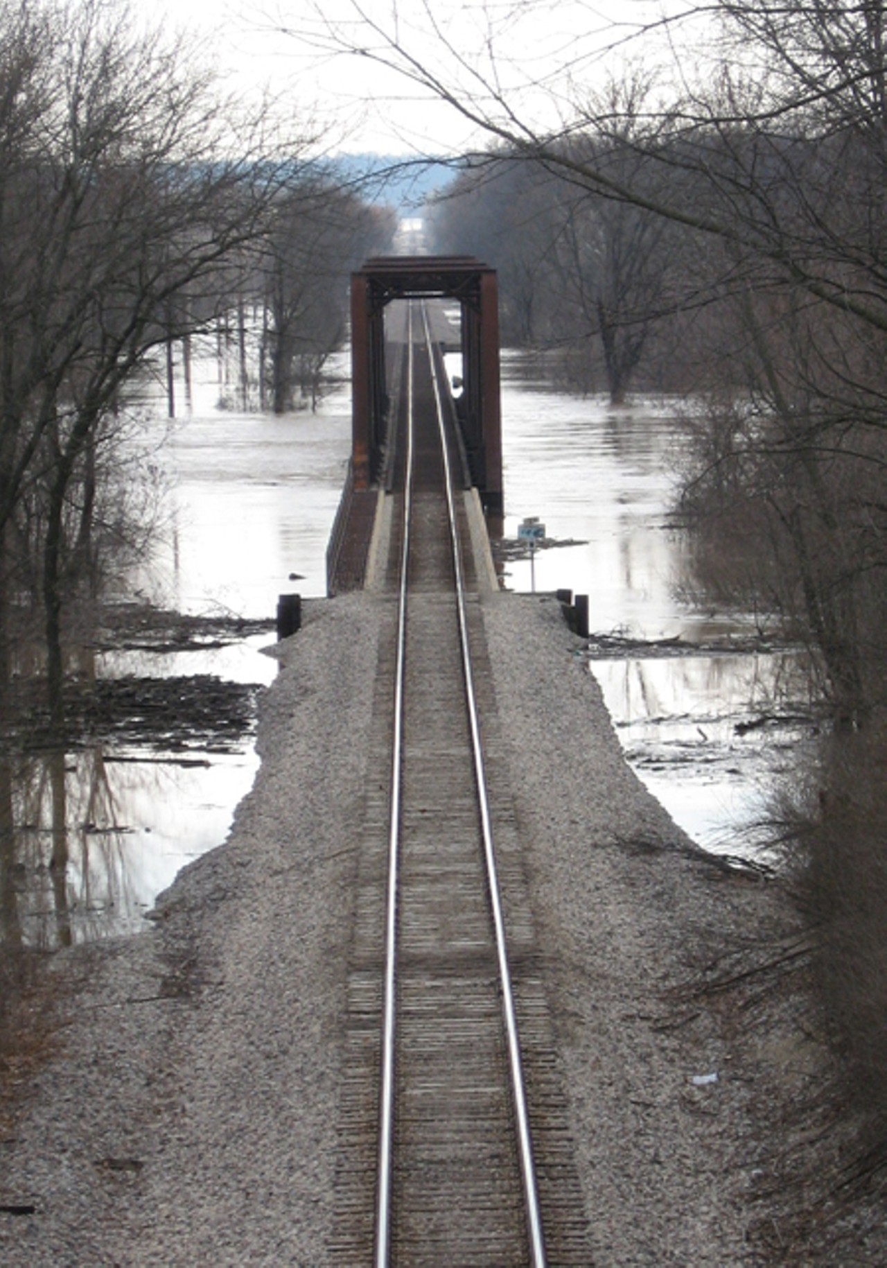 According to Randy, a resident of Baumgartner rd, up until Friday trains were still allowed to use the tracks that run underneath Baumgartner Road Bridge. They have since stopped due to the rising water.