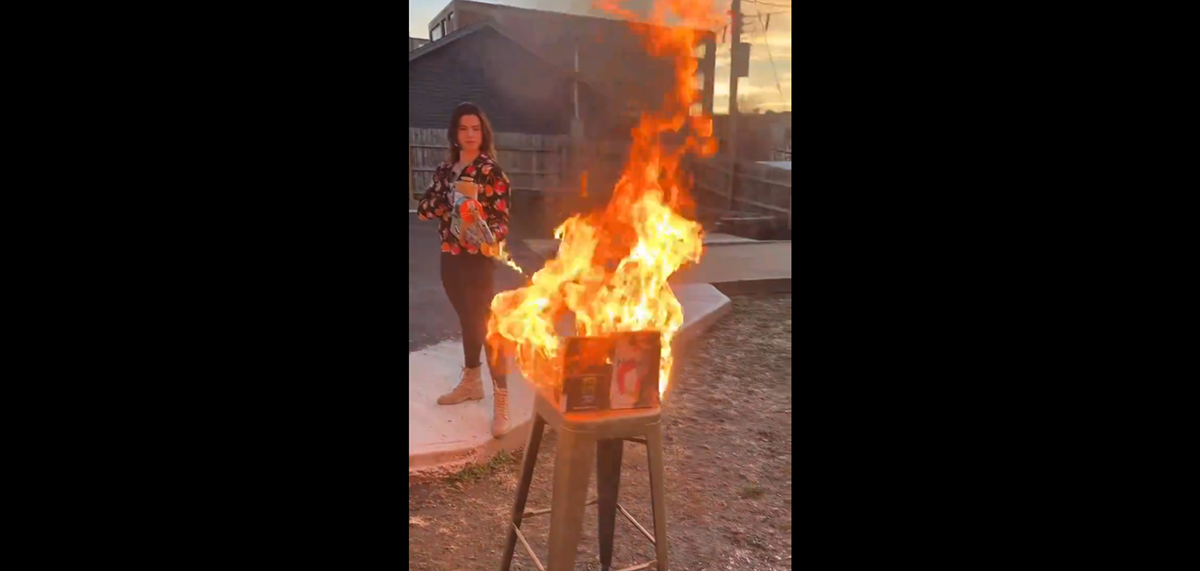 Valentina Gomez, a Republican Candidate for Secretary of State in Missouri, burns two queer library books in Springfield-Greene County.