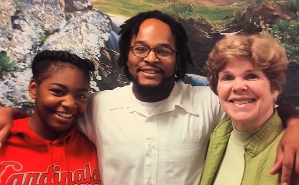 Kevin Johnson, center, with his former teacher Pamela Stanfield (right) and Johnson's daughter, Khorry Ramey. Johnson's family set off controversy when they adopted a stretch of I-44 in his honor.