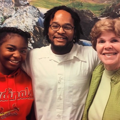 Kevin Johnson, center, with his former teacher Pamela Stanfield (right) and Johnson's daughter, Khorry Ramey. Johnson's family set off controversy when they adopted a stretch of I-44 in his honor.