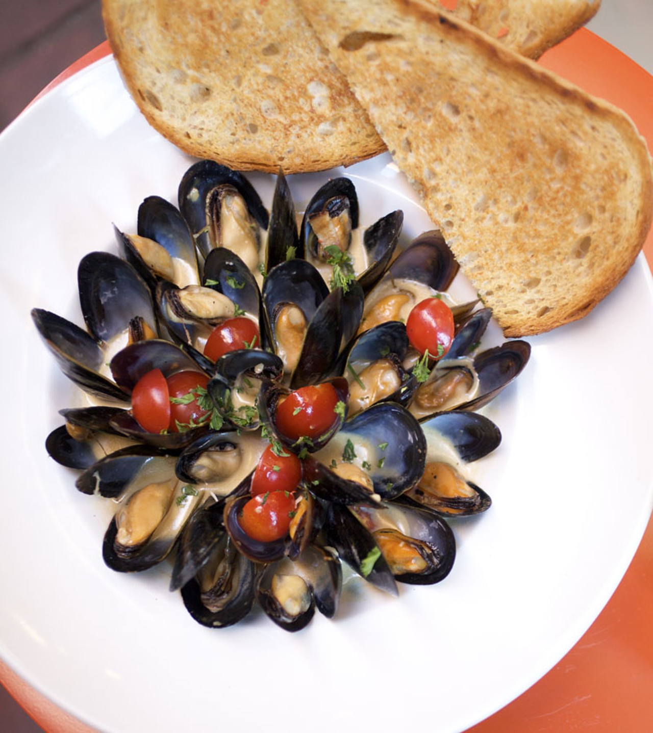 Prince Edward Island Mussels served in a pinot grigio and saffron creme with toasted garlic ciabatta.