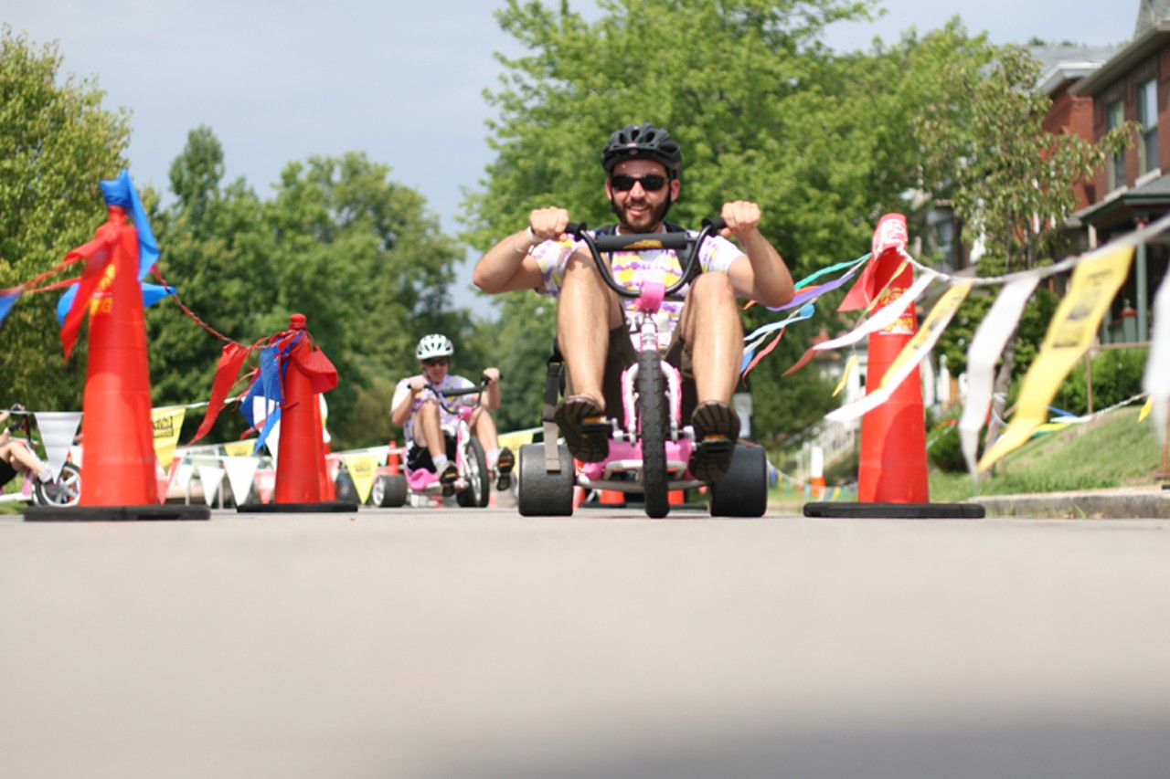 Riders put the pedal to the metal on big wheels at the Spin Out obstacle outside of BicycleWORKS. Riders must simply navigate the coned course.