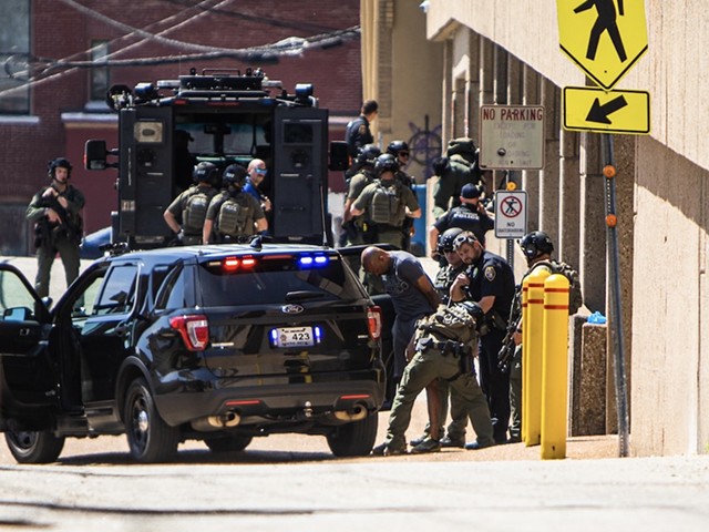 Police arrest an armed suspect who barricaded himself in a car on the lower level of a parking garage below the St. Charles County Human Resources Department on Monday, April 15, 2024.
