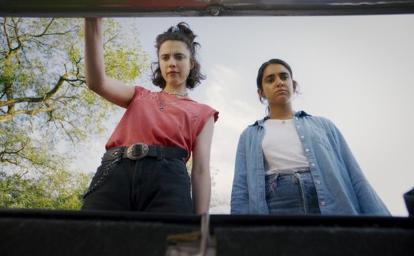 Margaret Qually and Geraldine Viswanathan eye the MacGuffin in the trunk.