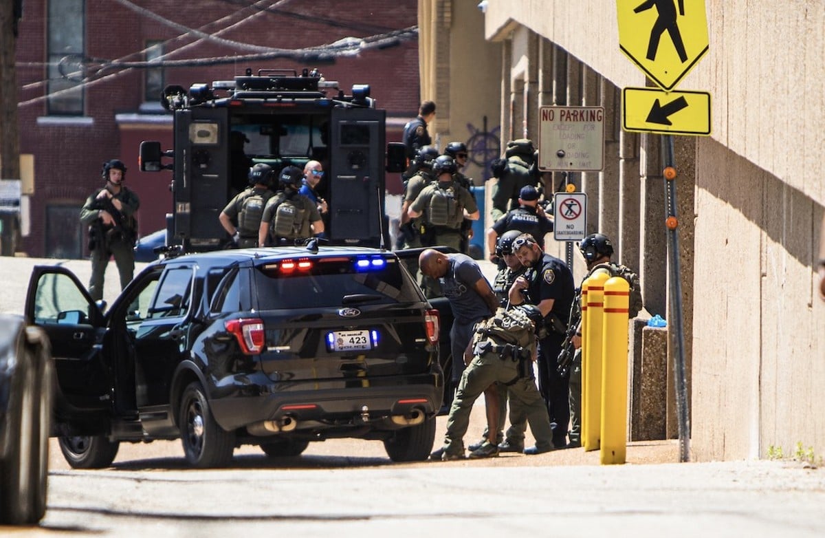 Police arrest an armed suspect who barricaded himself in a car on the lower level of a parking garage below the St. Charles County Human Resources Department on Monday, April 15, 2024.