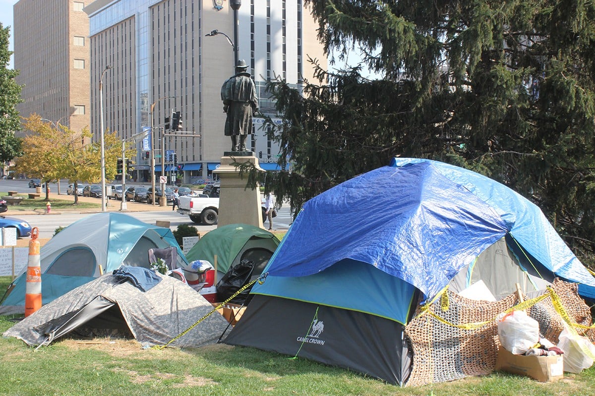 An encampment near Market Street at City Hall began over the summer as a small cluster of people. Dozens eventually moved in.
