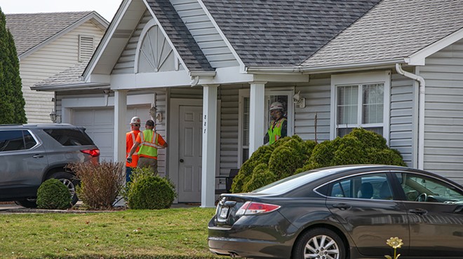 A group of people with the U.S. Army Corps of Engineers exit a home on Cades Cove on Monday, March 4, 2024, in Florissant. The Corps was drilling into the foundation of the house to test soil for radioactive material.