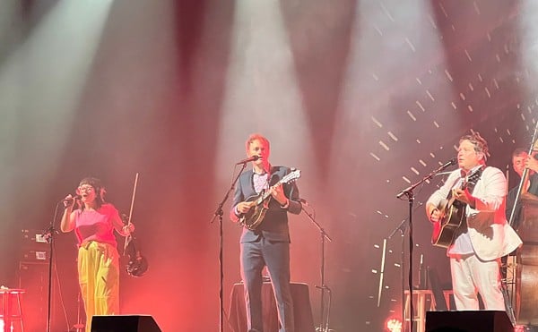 Chris Thile (center) displays his picking prowess and bluegrass wizardry on stage at the Factory.