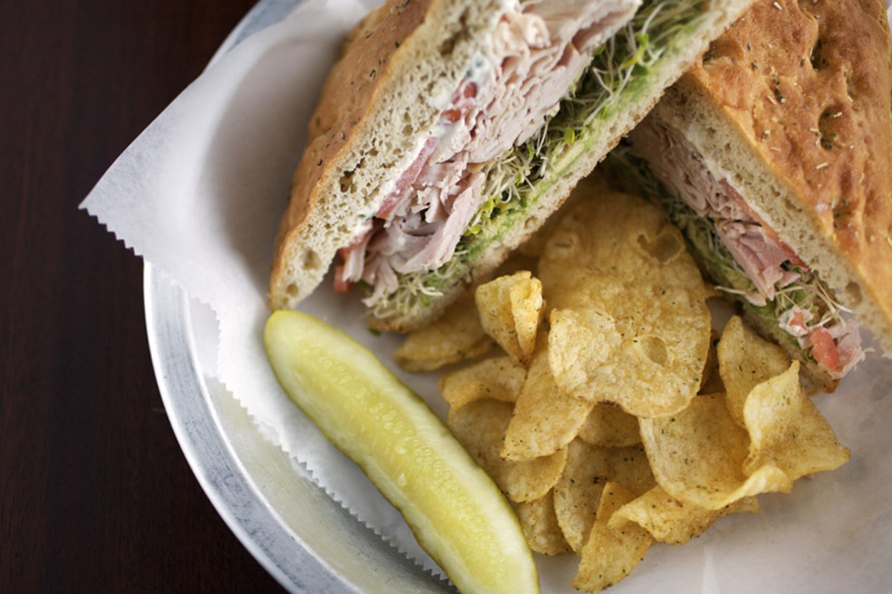 The Cold Turkey Sandwich, here shown on the gluten free bread from Free Range Cookies Bakery of Florrissant, MO, is offered at Nora's for any sandwich. The Cold Turkey is prepared with smoked turkey, avocado, sprouts, cream cheese and tomatoes.