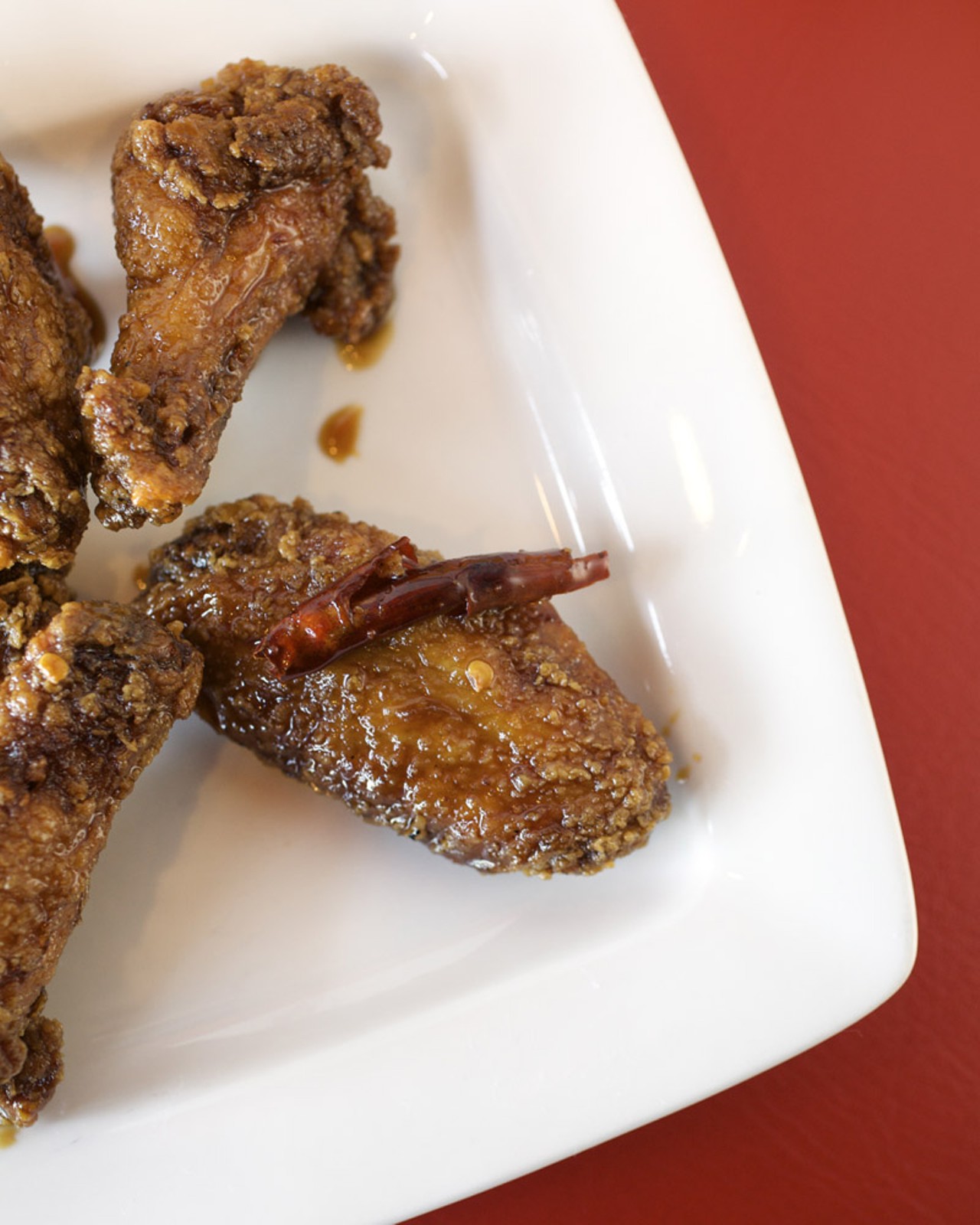 These wings are dressed in O's Original, a sauce that Heidi has been making at home for years. It is composed with the gentle heat of red chilies and caramelized brown sugar.