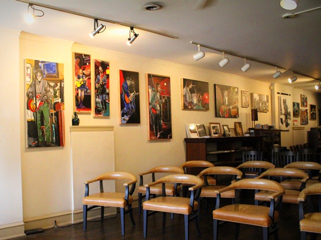 The art gallery has paintings from a local artist.
