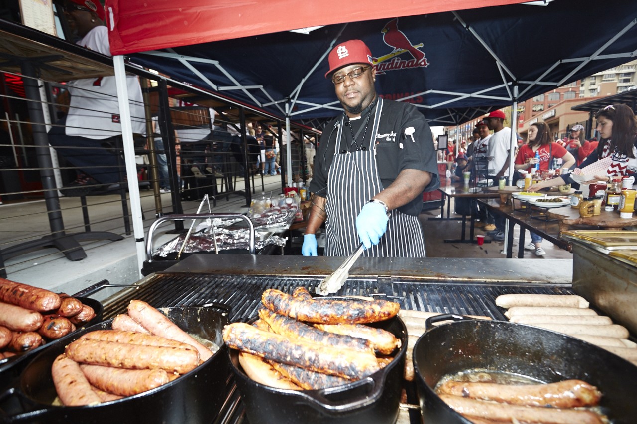 Chef Clarence grills up brats and weiners for Cardinal Nation.