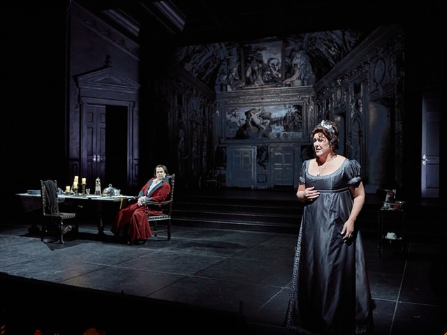 Katie Van Kooten (right) endures a Me Too moment from the wicked police chief Scarpia (Hunter Enoch) in Opera Theatre's vital new production of Tosca.