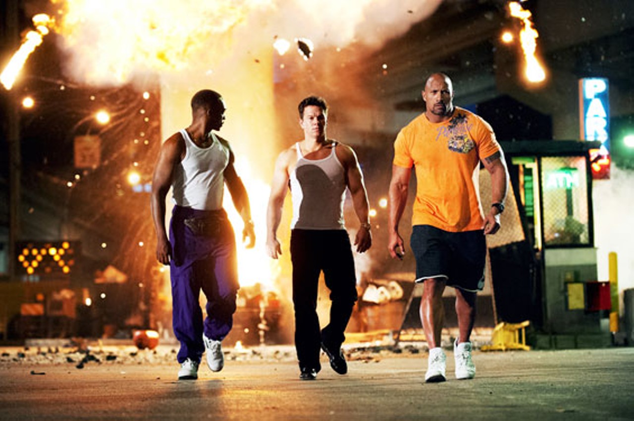 Pain & Gain opens Friday and features this Michael Bay signature shot: Men cooly walking away from an explosion.