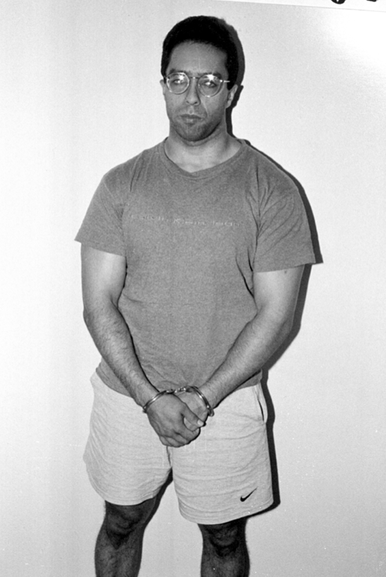 Daniel Lugo in handcuffs. Mark Wahlberg plays Lugo in the movie.