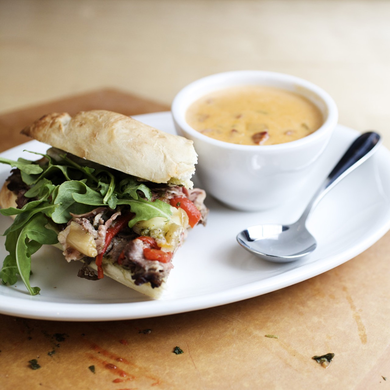 For a lunch special, you can order a half sandwich with a soup or salad. Shown here is a half "Brazilian" sandwich, which is sliced prime rib, arugula, roasted red pepper, caramelized onion, chimichurri and provolone. And the soup is the Corn & Chorizo Chowder.