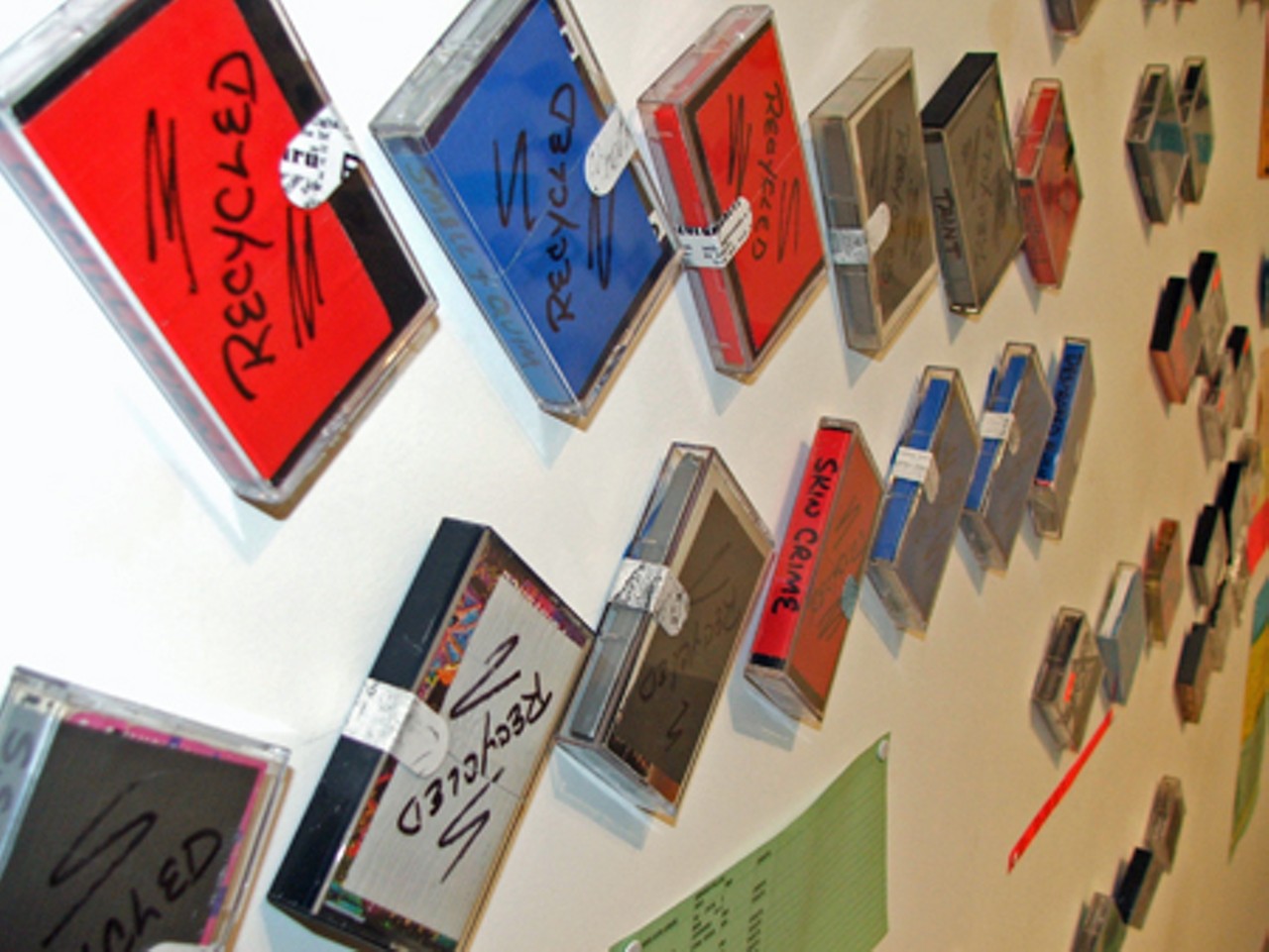 More than 100 cassette tapes will stay Velcroed to the walls of the Contemporary Art Museum through Sunday, April 20.