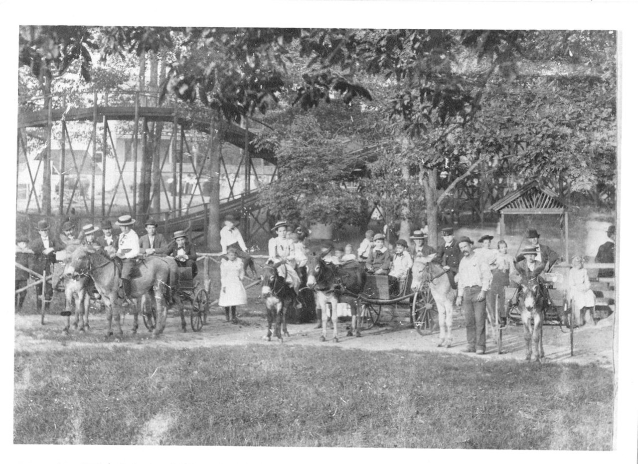 Montesano Springs Park
Kimmswick, MO
(Closed in 1918)Built near famed mineral springs, this park boasted a hotel and restaurant, a dance pavilion, a lake, a merry-go-round, and more. According to the state archives, "Kids line up for donkey rides at Montesano Park, an early theme park in Missouri. The Switchback gravity-powered roller coaster is visible in the background."