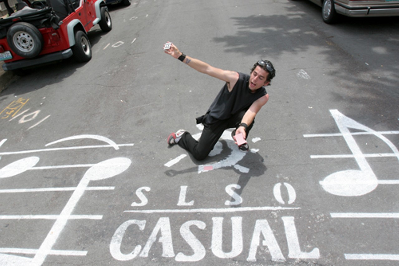 Jason Lee Jones attempts to perform magic tricks on the streets of Delmar Boulevard and Westgate Avenue.