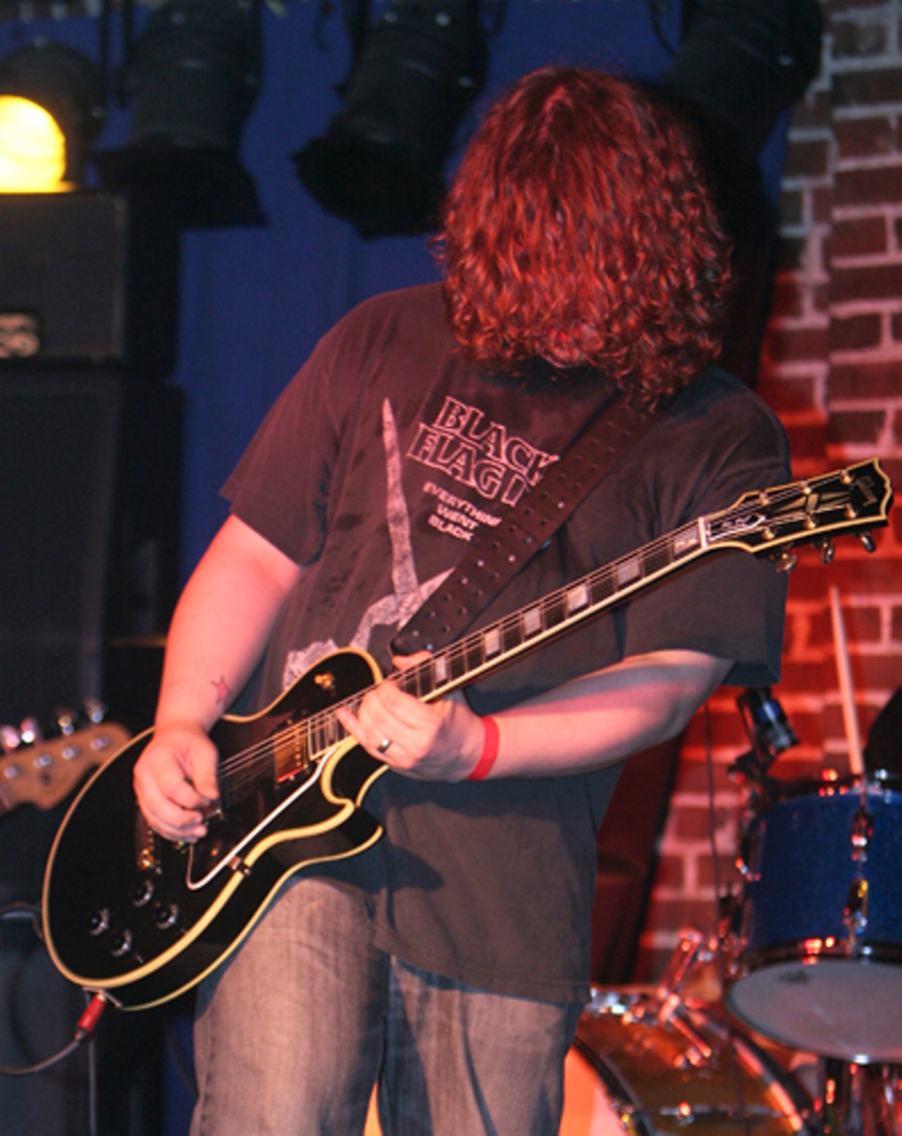 Jon Lumley, of Shame Club, plays his guitar at the Duck Room in Blueberry Hill.
