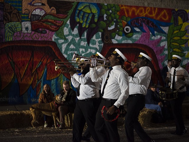 The Red and Black Brass Band perform.