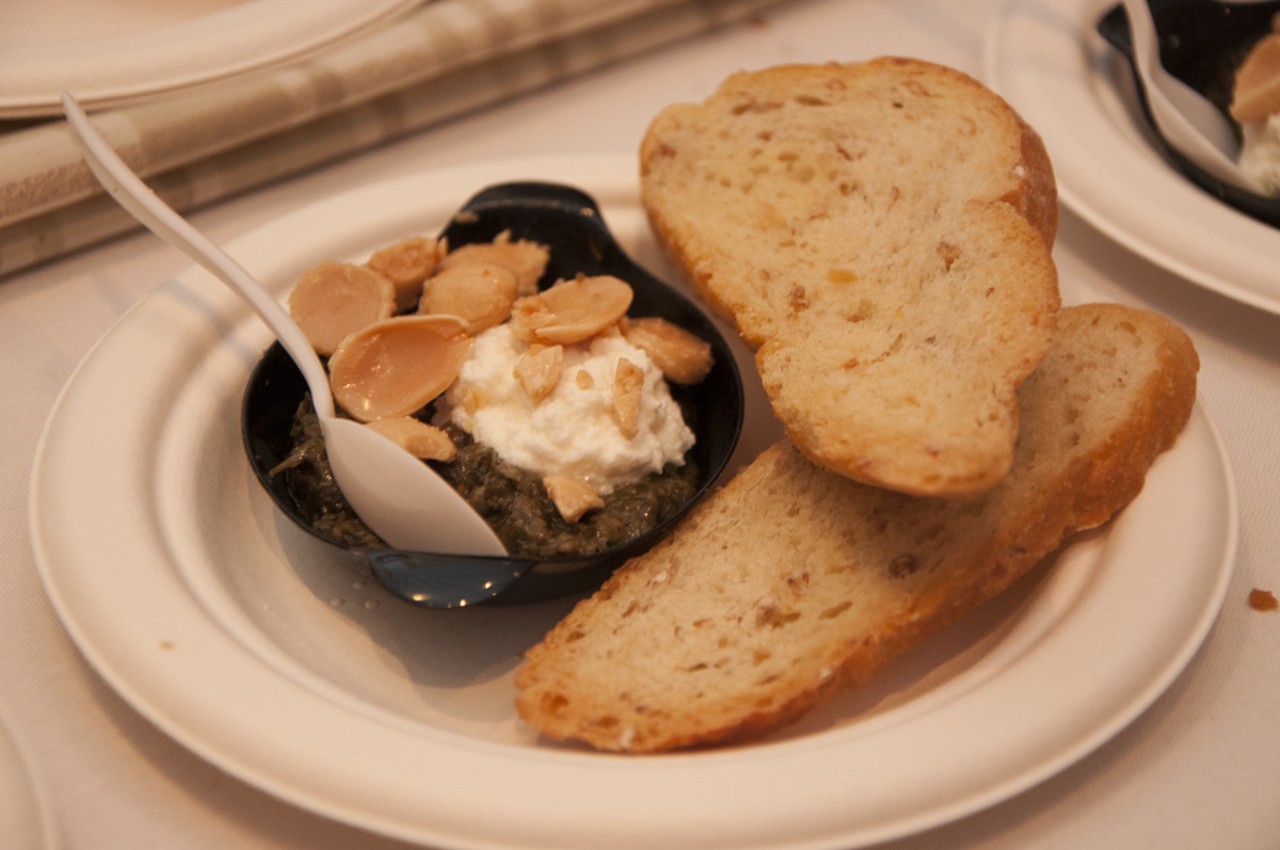 Grilled peasant bread with baked ricotta con latte, charred oinion pesto and marcona almonds from Quincy Street Bistro.