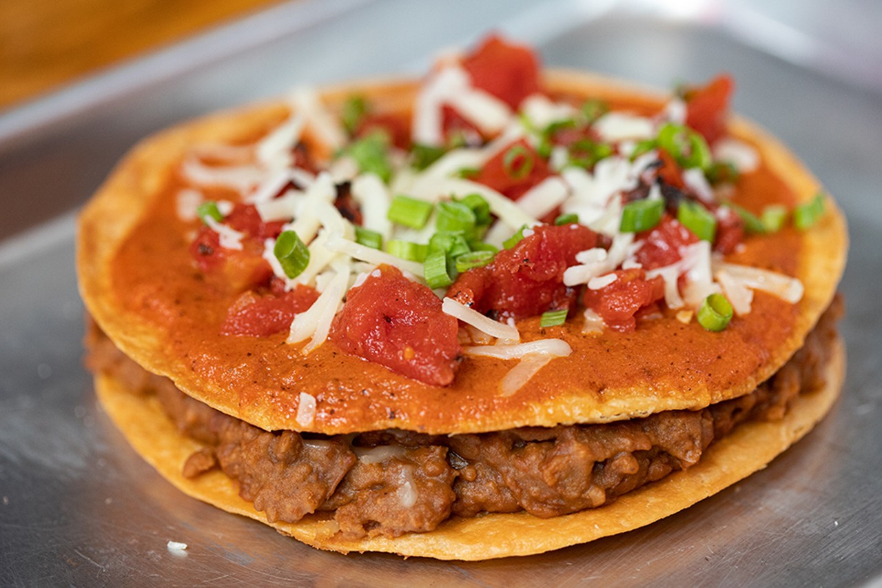 Mexican Pizza with crispy flour tortillas, beans, beef, cheese and enchilada sauce.