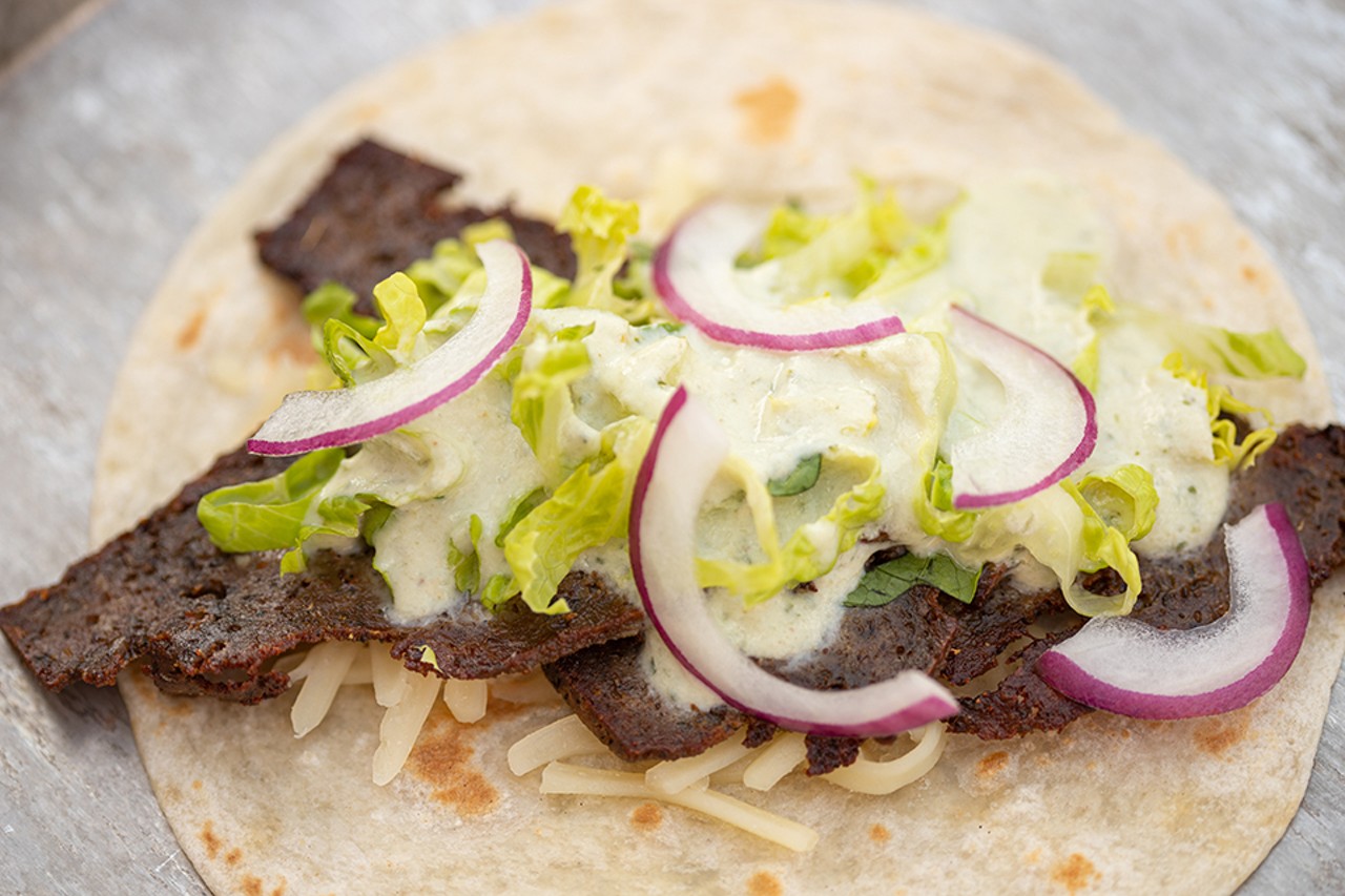 There Goes My Gyro taco with housemade all-beef gyro meat, cheese, lettuce, purple onions and tzatziki.
