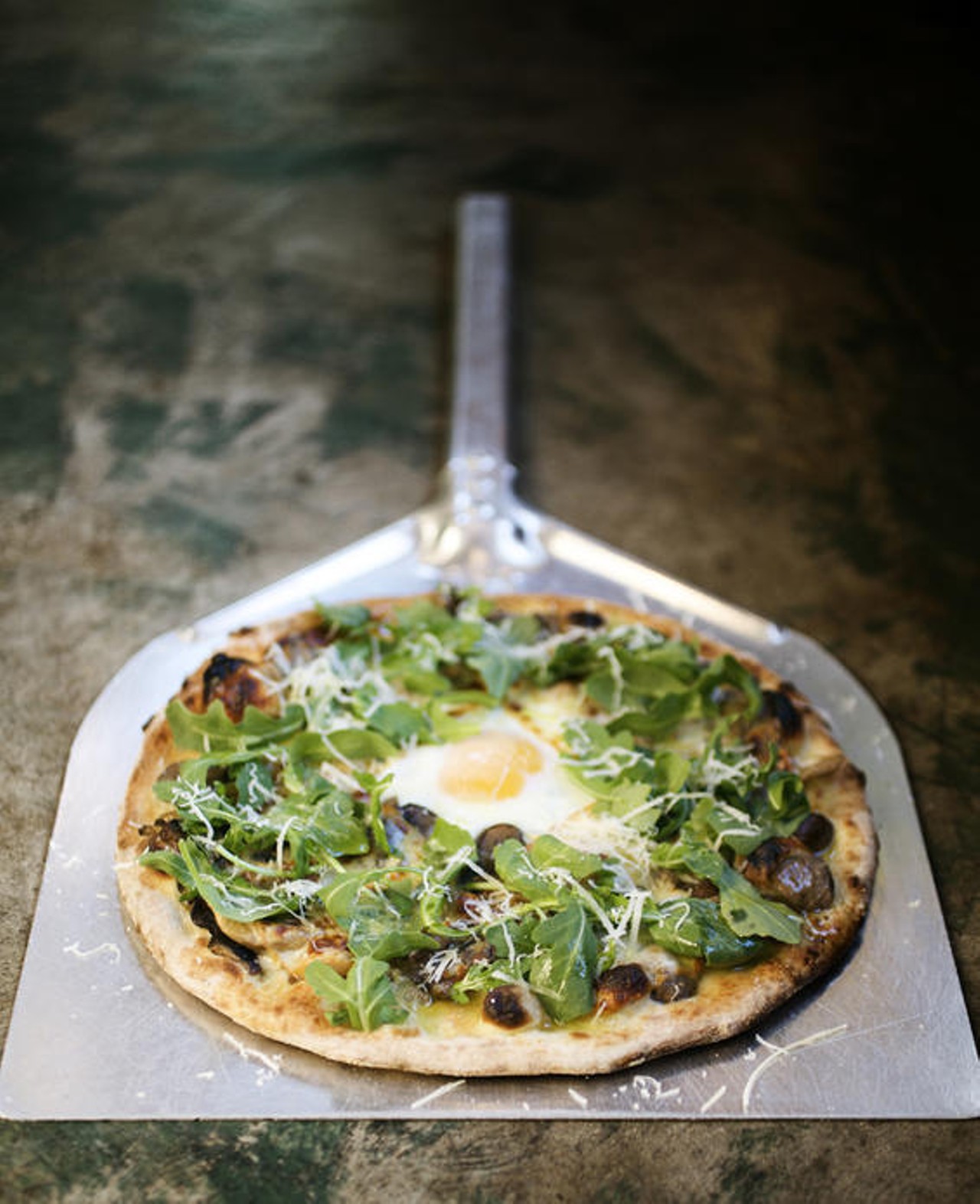 The Fungi Pizze is made with wild mushrooms, smoled mozzarella, garlic, basil, arugula, grana, olive oil, and you can add an egg for an additional fee. Any really...why wouldn't you?