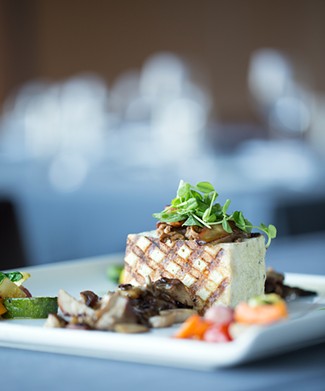 The "Marinated, Pressed and Grilled Tofu" is constructed from roasted Ozark mushrooms, petit root vegetables and two celery coulis.