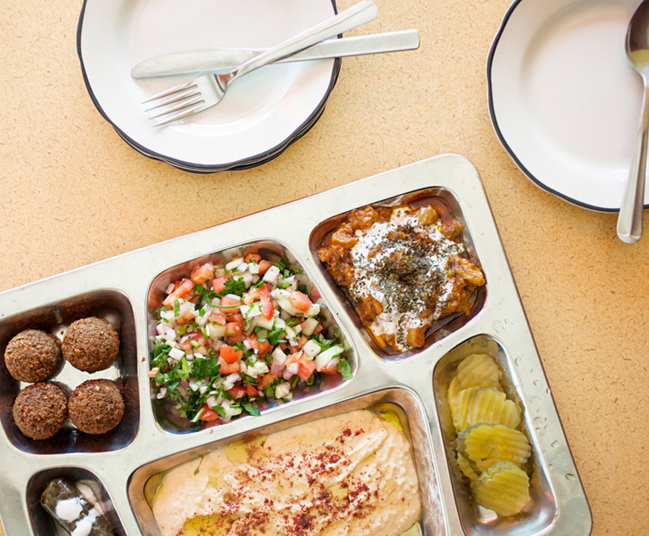 The "Mediterranean Feast" includes falafel, eggplant-stuffed grape leaves, hummus and shirazi salad.