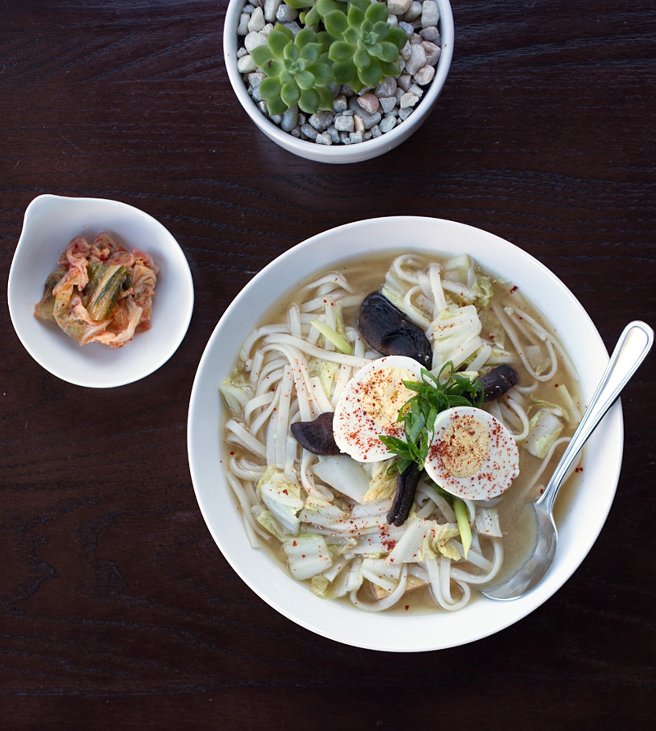 Obaachan's -- or Grandma's -- udon soup is a bowl of noodles, vegan dashi, red miso, cabbage, shiitake mushroom, scallion, tofu and a side of kimchi. Here, it's seen with the optional hard-boiled egg.
