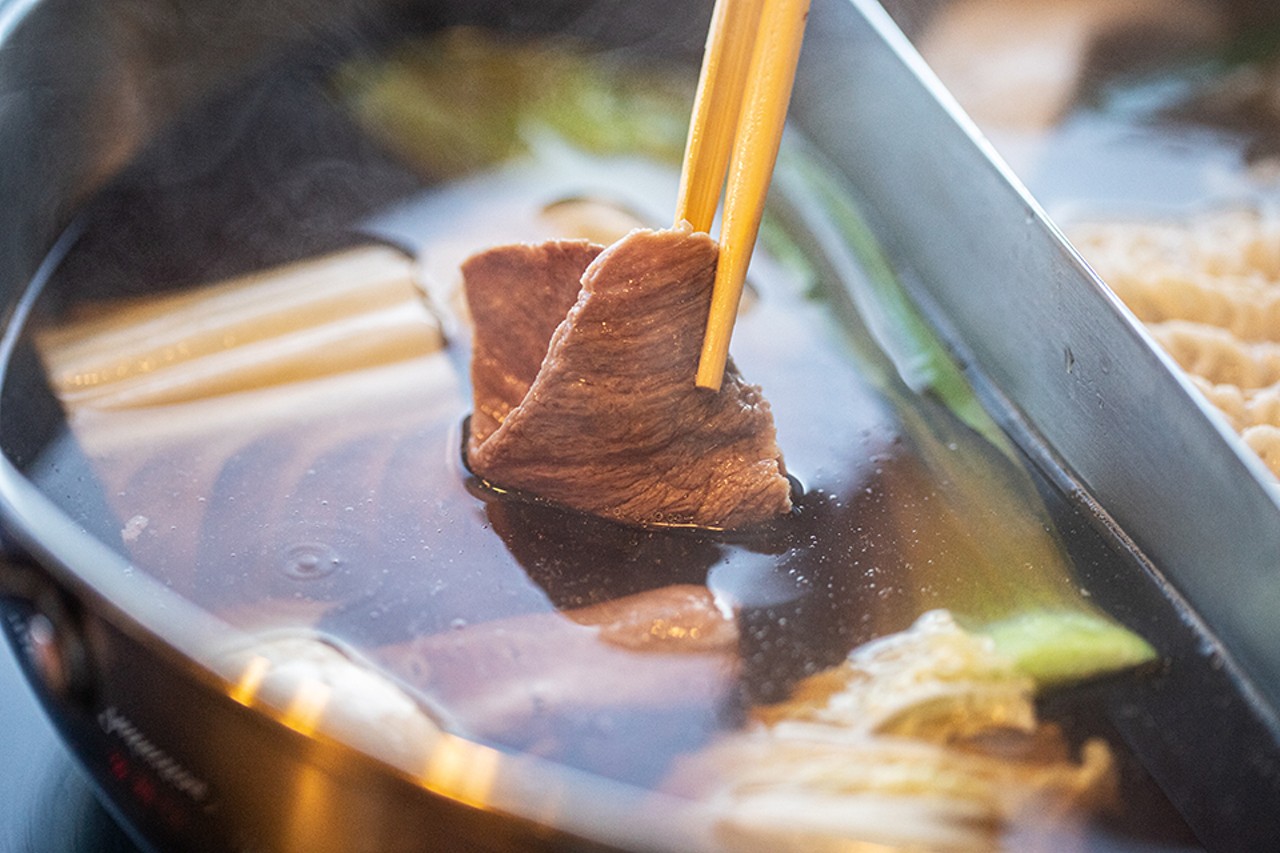 Meat is cooked up in the steaming hot broth in an instant.