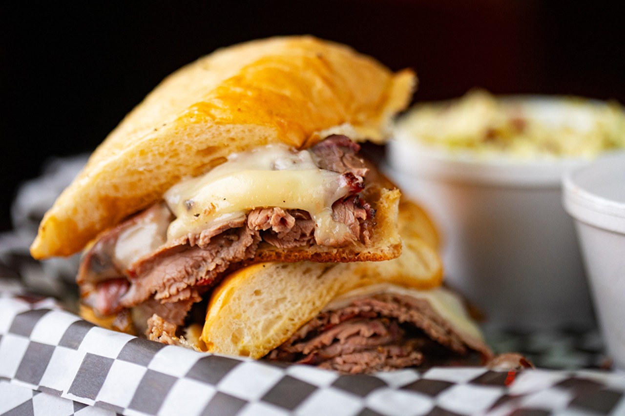 Brisket Dip with grilled onions and Swiss on a buttery toasted baguette.