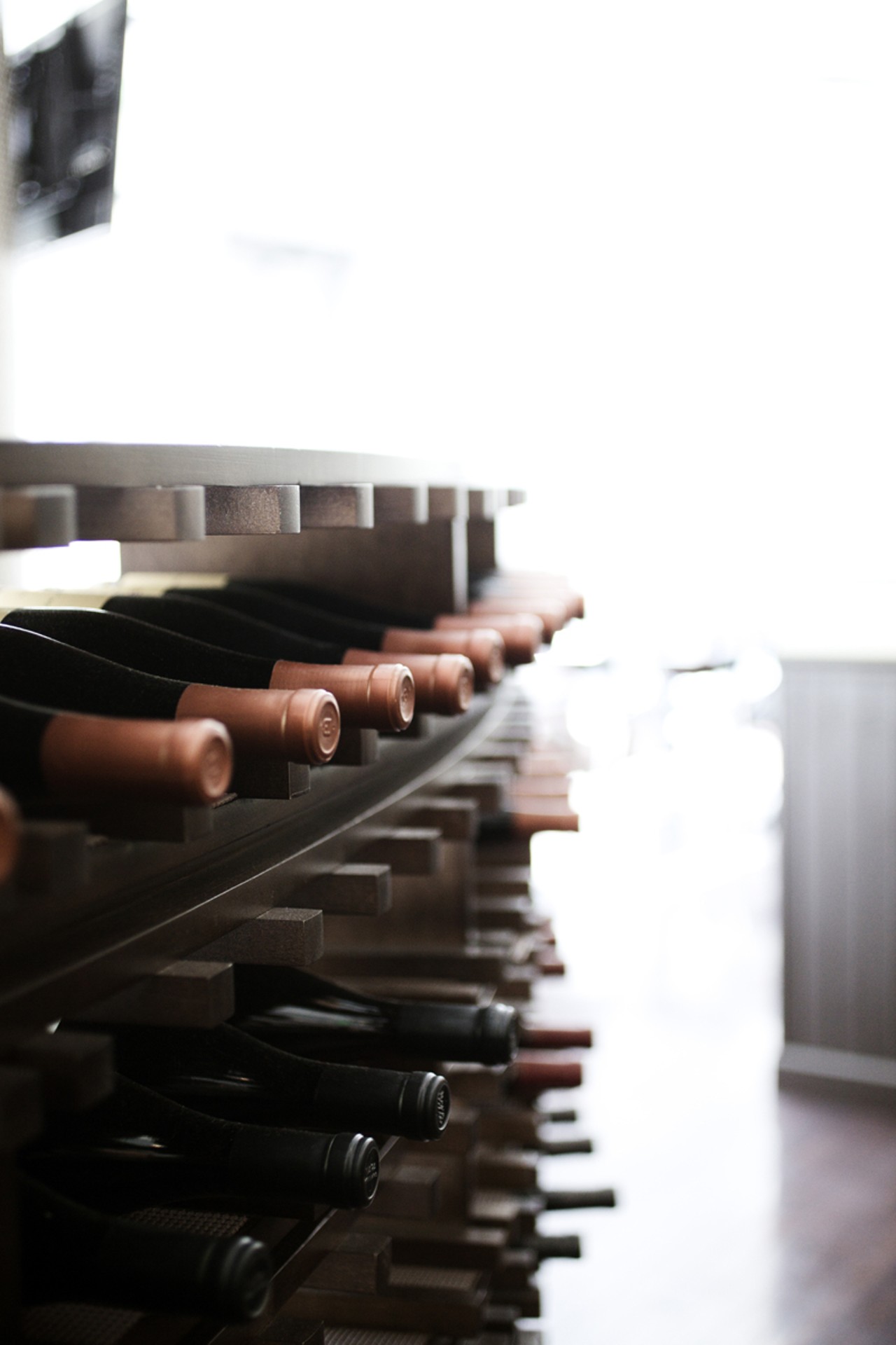 The wine racks that serve also as a sort of room divider when entering the main dining room of Shula's 347.