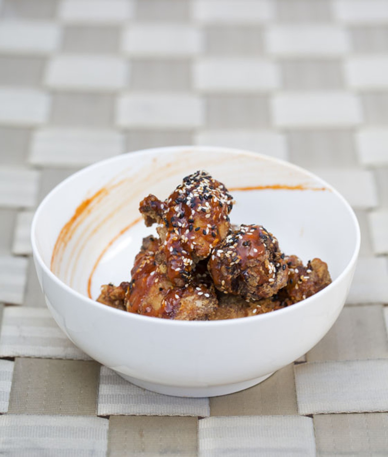 Korean Fried Chicken "KFC" is Korean-style fried chicken wings, sweet soy reduction and Siam sauce.