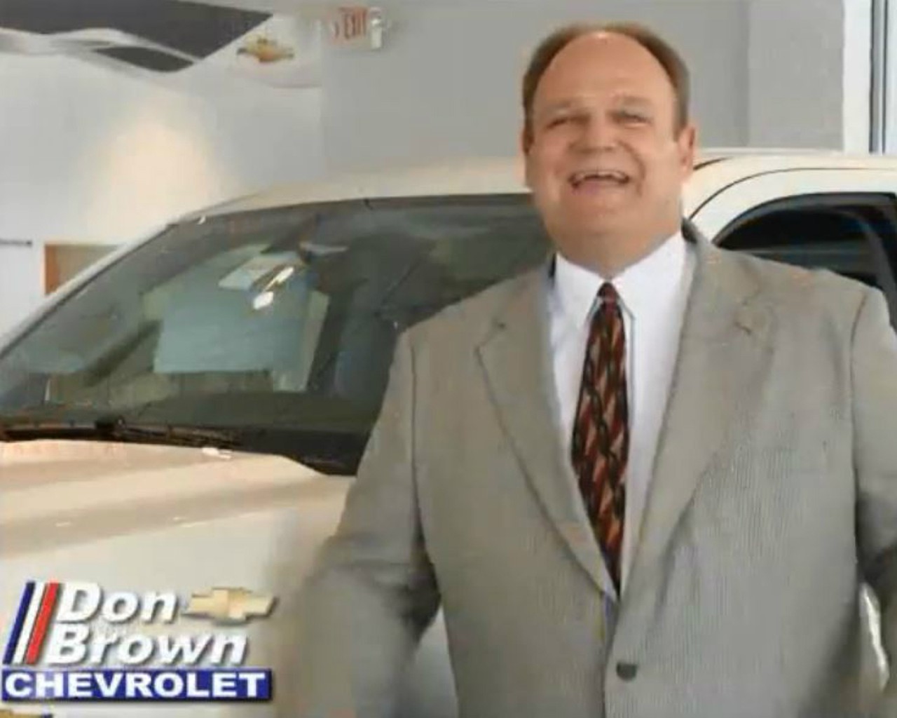 You've learned which guy's dealership is "at the entrance to the Hill."
Photo courtesy of screengrab via YouTube