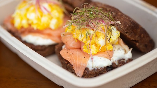 Janie's Mill rye biscuits with house-cured salmon, creme fraiche, dill micros and sieved egg.