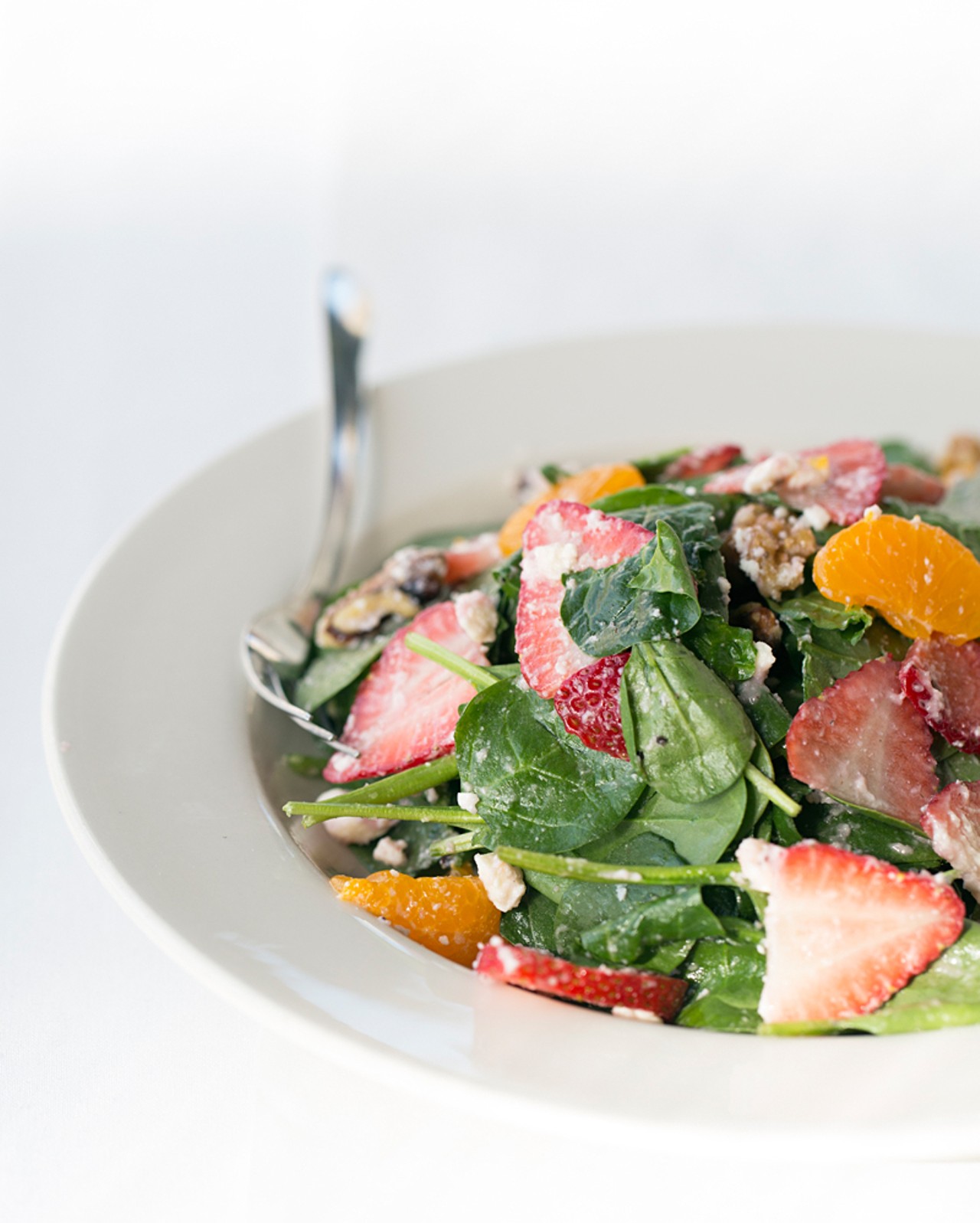 The "Cafe Orleans" salad is made with baby spinach, strawberry, madarin orange, black walnut, crumbled feta and red-onion dressing.