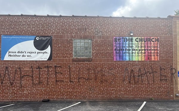 The graffiti covers a large portion of Grace United Church of Christ's exterior wall.