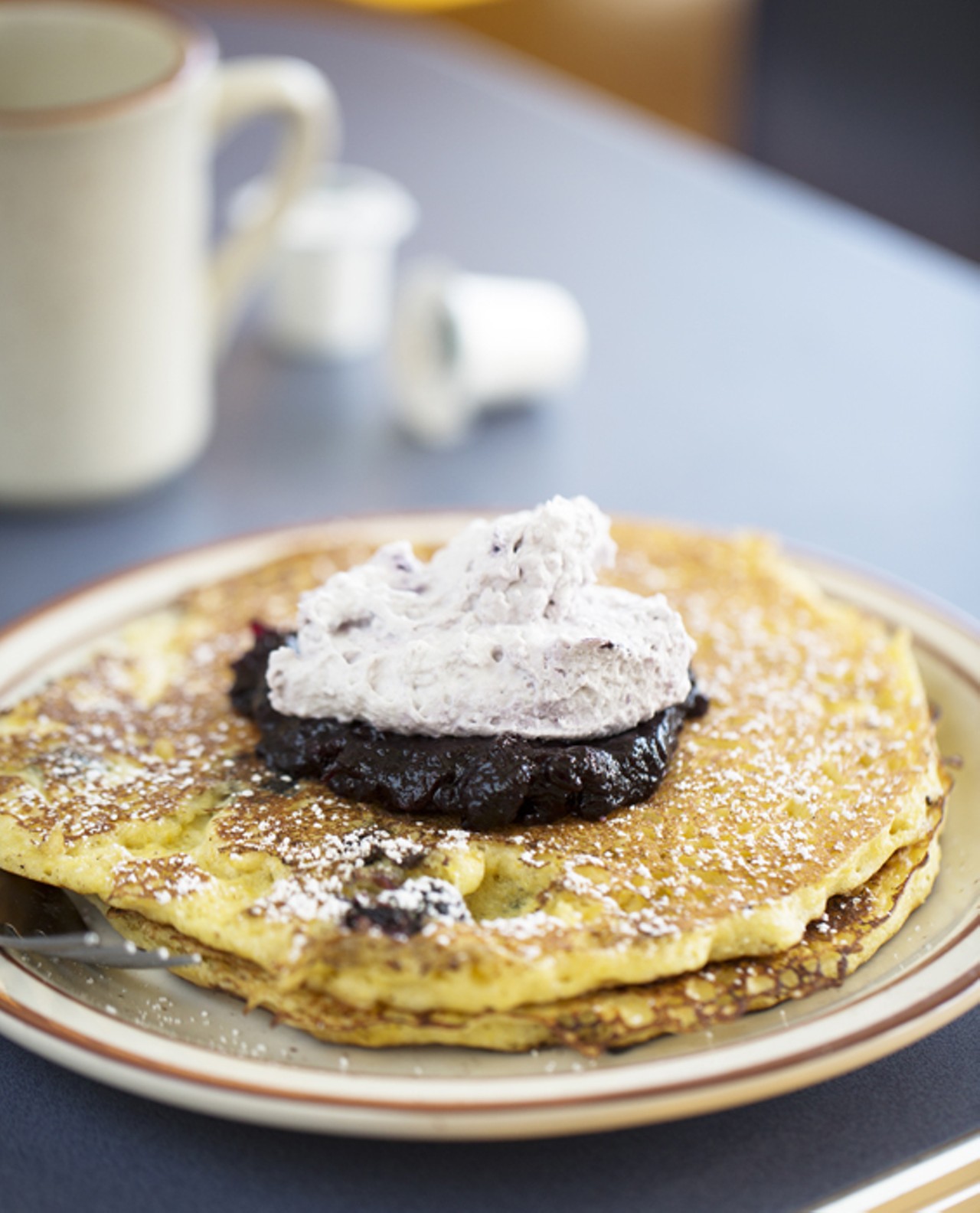 A current special, triple blueberry pancakes, takes their regular Buttermilk Cornmeal Pancakes, and adds blueberries to the batter. Topped with both blueberry compote and blueberry whipped cream.