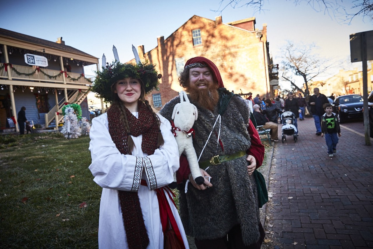 Santa Lucia, left, poses with Julenisse. Santa Lucia is the saint of light and vision and is celebrated in Scandinavian countries. Children in Sweden dress like her on her feast day, December 13, and deliver traditional Swedish buns to their families. Entire villages also recognize the day, known as "St. Lucy's Day," with parades and other events.