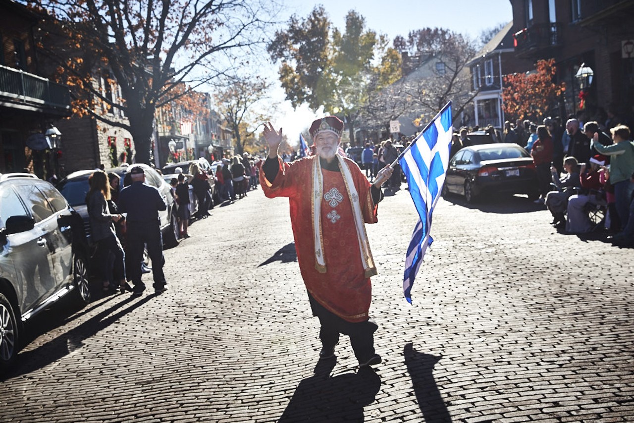 Saint Nicholas, a holiday icon from Greece, parades down the street.