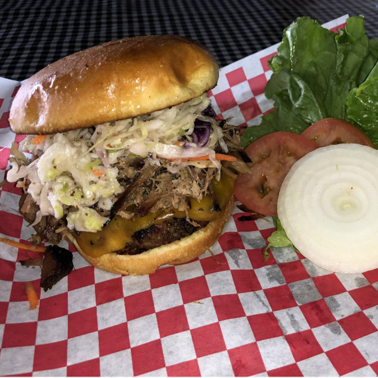 Sharpshooter&#146;s Pit & Grill
(8135 Gravois Road; 314-353-4745)
The Stanley: Our half pound burger topped with your choice of fresh smoked pulled pork or fresh smoked brisket, melted cheddar cheese and slaw on a soft, butter toasted bun,