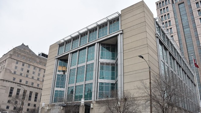 The fourth-floor windows of the City Justice Center were boarded up after Saturday's revolt.